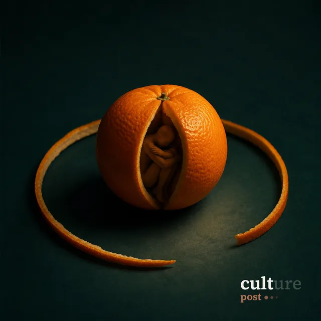 An orange peel unrolled on a dark surface with a curled figure inside the fruit